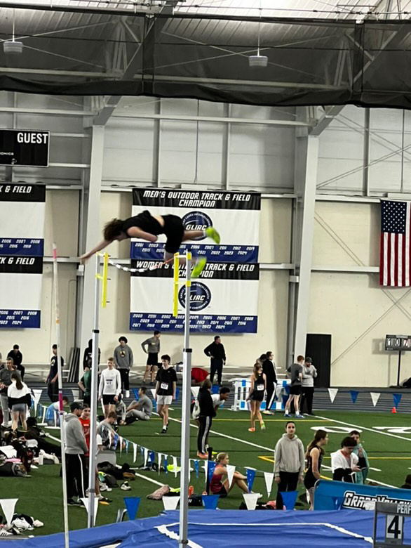 Ben Goran sails over the beam. The pole vaulter broke the freshman record in the first track meet of the year. 