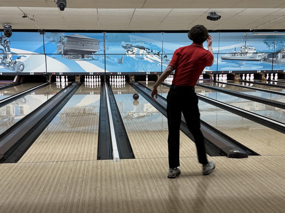 Hudson Case watches his ball fly down the lane. The senior finished 6th for All-Conference honors this season.